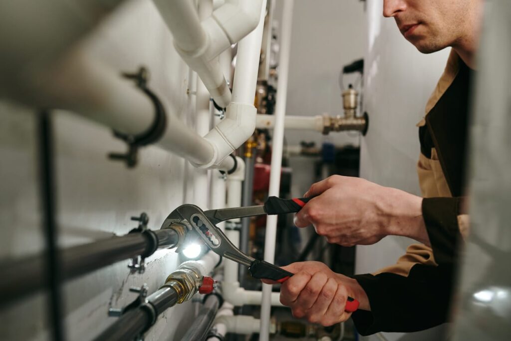 Plumbers maintaining commercial plumbing pipes in San Bernardino
