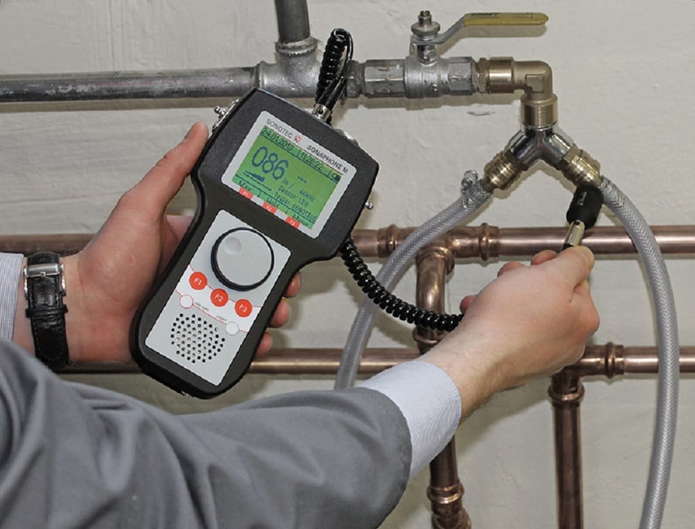 Plumber testing pipes with electronic leak detection equipment in San Bernardino